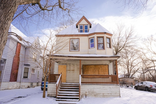 victorian house featuring covered porch