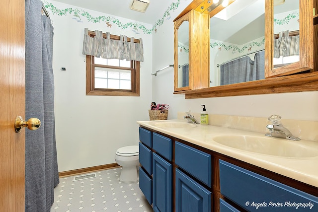 full bathroom with double vanity, visible vents, toilet, and a sink