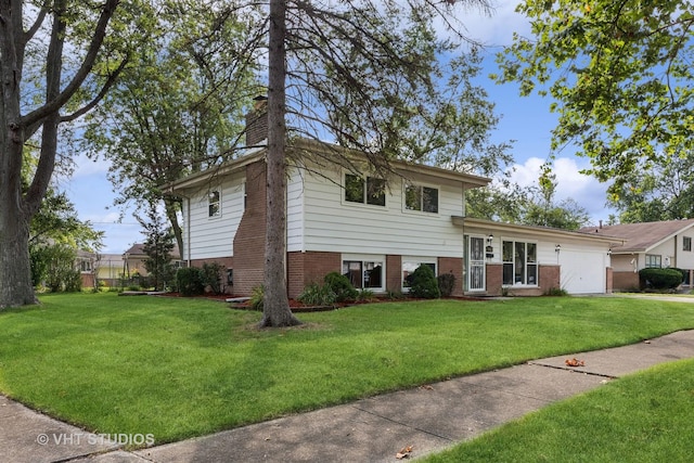 tri-level home with a front yard