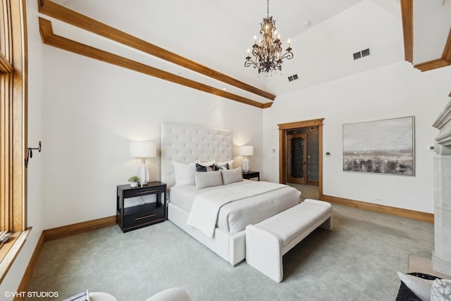 bedroom with a chandelier and light carpet