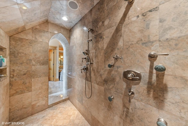 bathroom with a tile shower