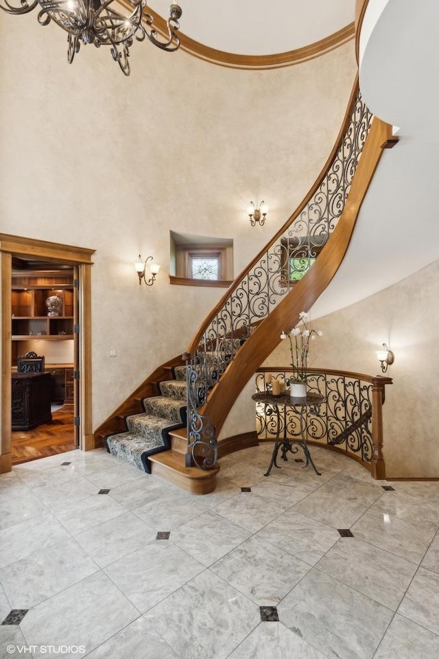 stairs featuring a high ceiling