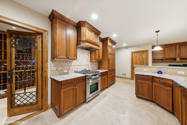 kitchen featuring decorative backsplash, high end stainless steel range oven, custom exhaust hood, hanging light fixtures, and light stone counters