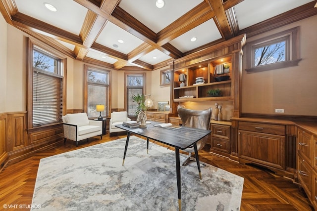 office space featuring coffered ceiling, ornamental molding, dark parquet flooring, and beam ceiling