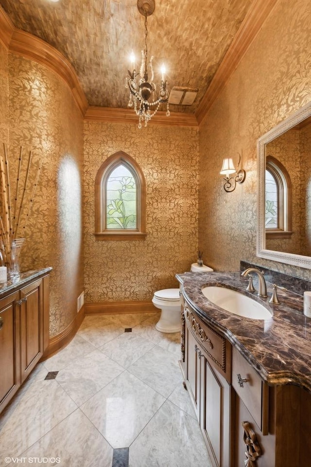 5101 Central Ave, Western Springs, IL 60558 - bathroom featuring ornamental molding, vanity, a chandelier, and toilet