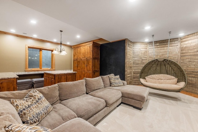 carpeted living room featuring crown molding