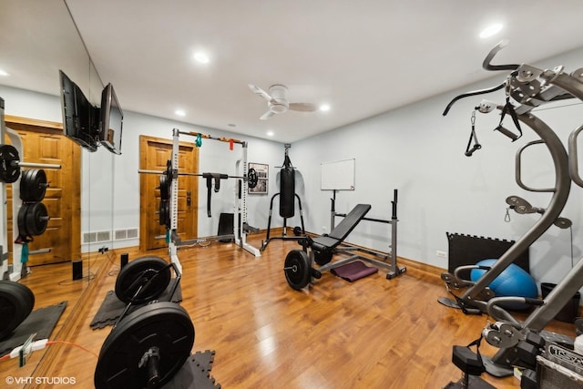 exercise area featuring light hardwood / wood-style flooring