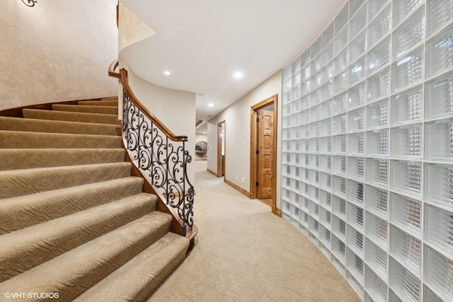 staircase with carpet floors