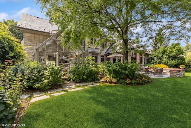 view of yard featuring a fire pit and a patio area