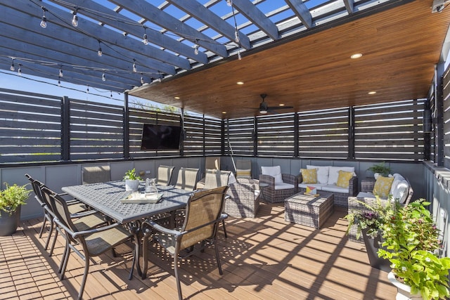 view of patio / terrace with outdoor dining area, ceiling fan, an outdoor hangout area, and a pergola