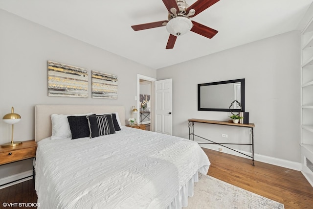 bedroom with wood-type flooring and ceiling fan