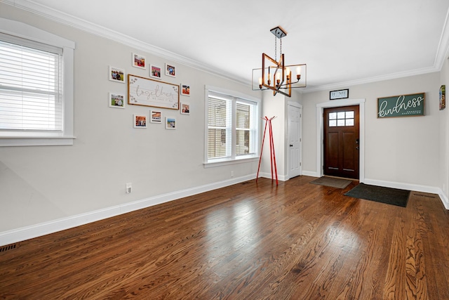 entrance foyer with dark wood-style floors, plenty of natural light, crown molding, and baseboards