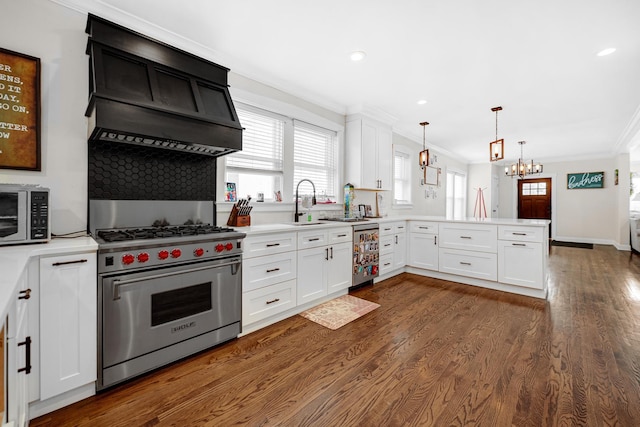 kitchen with white cabinetry, appliances with stainless steel finishes, and light countertops