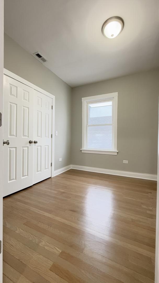 unfurnished room with light hardwood / wood-style flooring