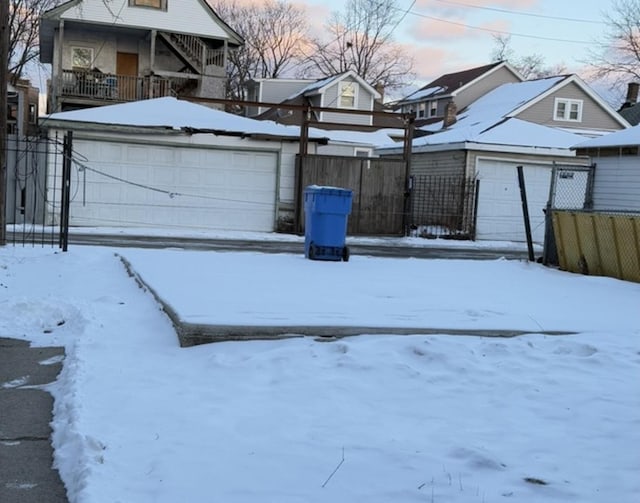 yard covered in snow featuring a balcony