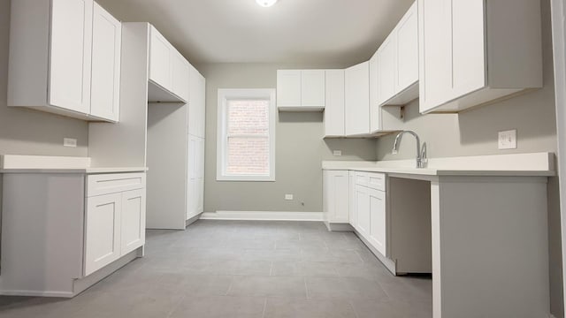 kitchen with sink and white cabinets