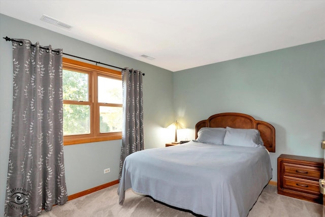 bedroom with light colored carpet