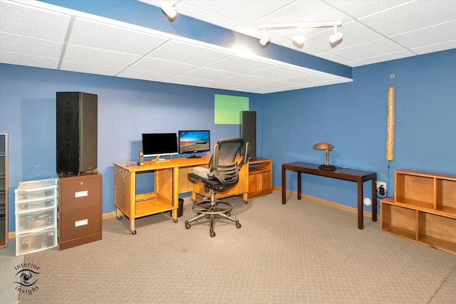 office featuring track lighting, carpet flooring, and a paneled ceiling