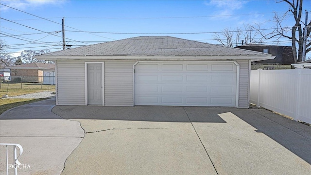 detached garage with fence