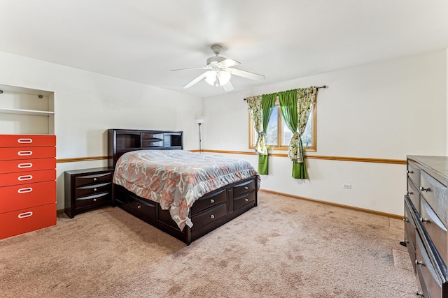 bedroom with carpet, ceiling fan, and baseboards