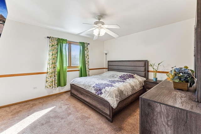 bedroom with carpet flooring, ceiling fan, and baseboards