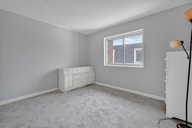 empty room with light colored carpet