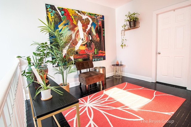 interior space featuring wood finished floors and baseboards