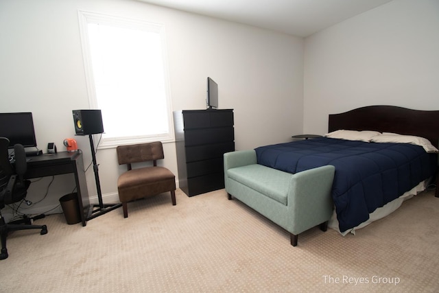 bedroom with carpet flooring and baseboards