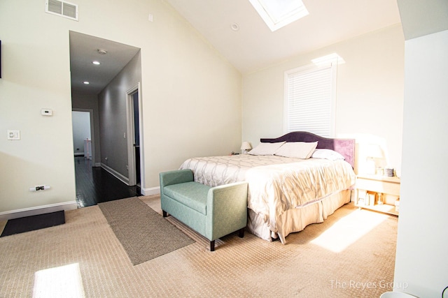 carpeted bedroom featuring visible vents, high vaulted ceiling, recessed lighting, a skylight, and baseboards