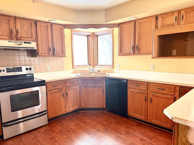 kitchen featuring electric stove, sink, dishwasher, dark hardwood / wood-style flooring, and decorative backsplash