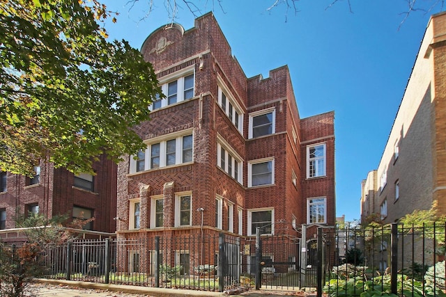 view of property featuring a fenced front yard