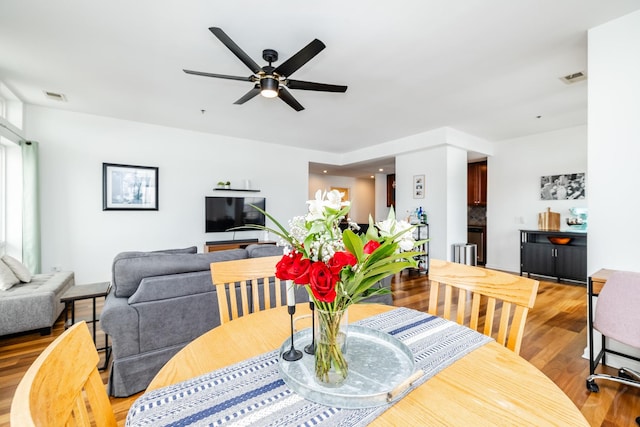 dining area featuring ceiling fan and light hardwood / wood-style flooring