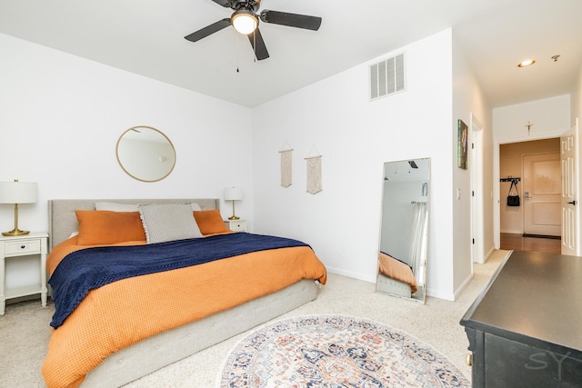 bedroom with light carpet and ceiling fan