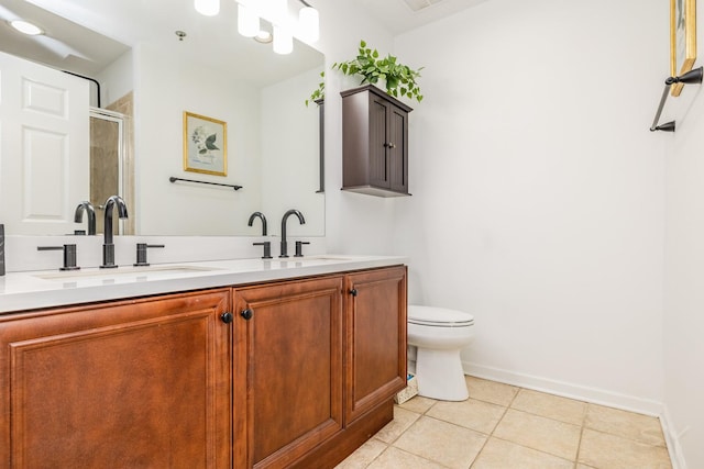 bathroom featuring vanity, an enclosed shower, toilet, and tile patterned floors