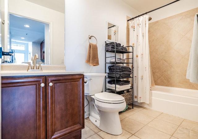 full bathroom with shower / bath combo with shower curtain, vanity, tile patterned flooring, and toilet