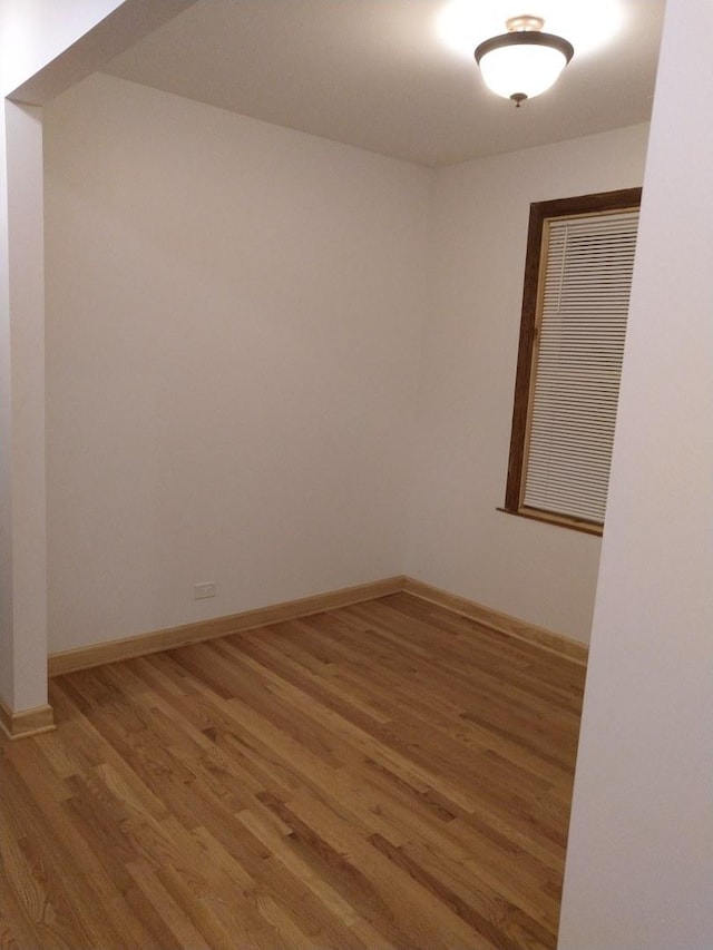 2921 N Kedzie Ave, Chicago, IL 60618 - spare room with baseboards and wood finished floors