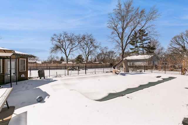 snowy yard with fence