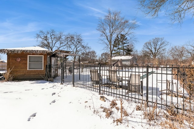 snowy yard with fence