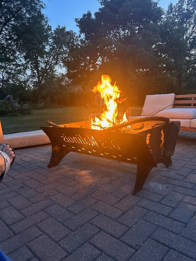 view of patio with an outdoor fire pit