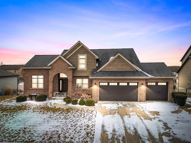 craftsman-style house featuring a garage, brick siding, and central AC unit