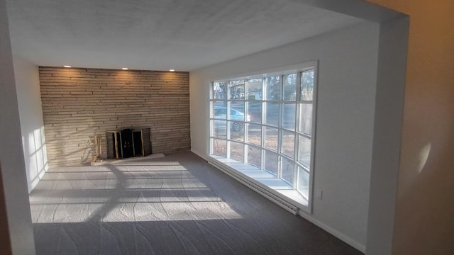 unfurnished living room with a large fireplace and recessed lighting