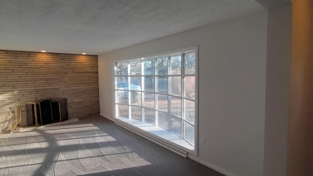 unfurnished living room with a stone fireplace