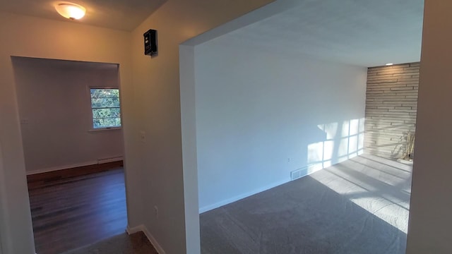 empty room with visible vents and baseboards