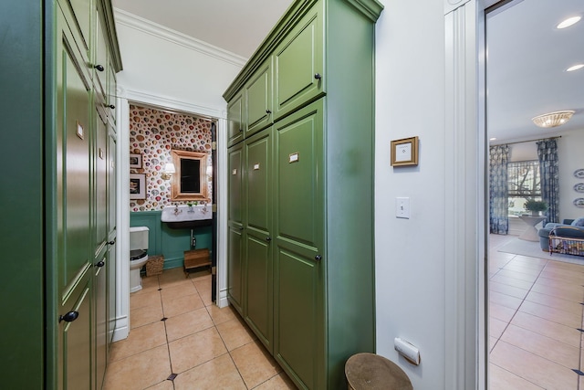 hallway with recessed lighting, crown molding, and light tile patterned flooring