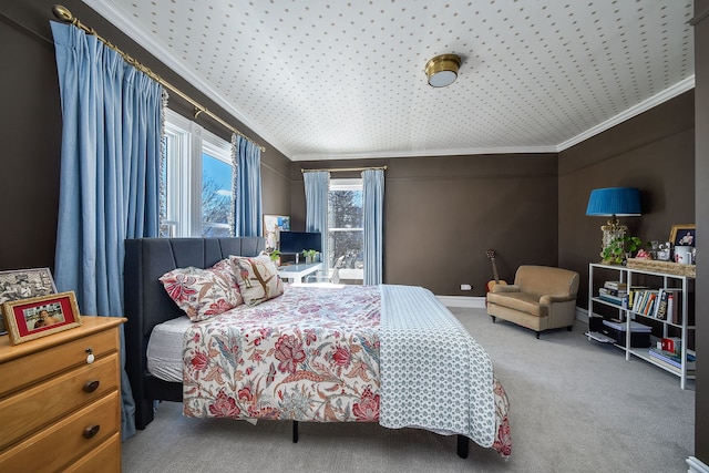 carpeted bedroom with baseboards and crown molding