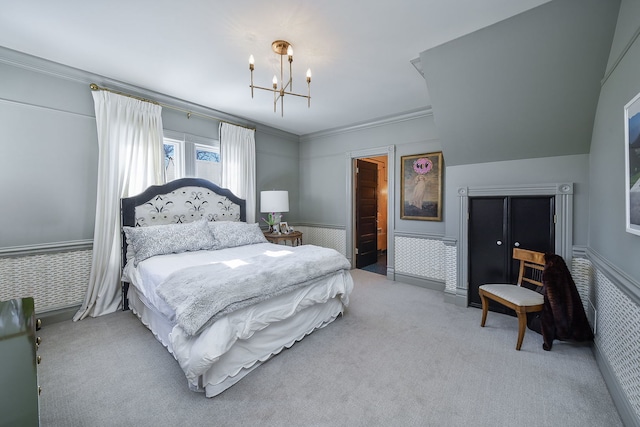 bedroom with crown molding, wainscoting, carpet flooring, and a notable chandelier