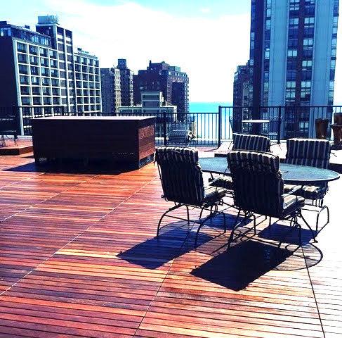 wooden deck featuring a water view