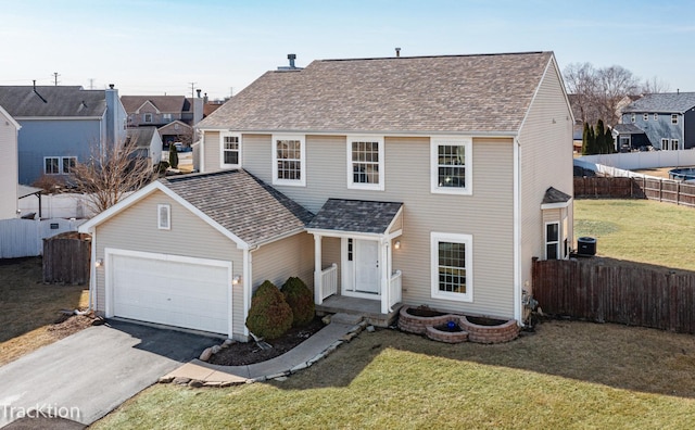 traditional-style house featuring aphalt driveway, roof with shingles, a front lawn, and fence