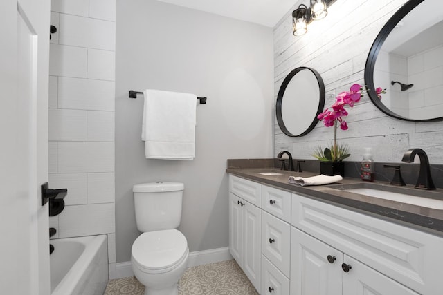 full bathroom featuring shower / tub combination, vanity, and toilet