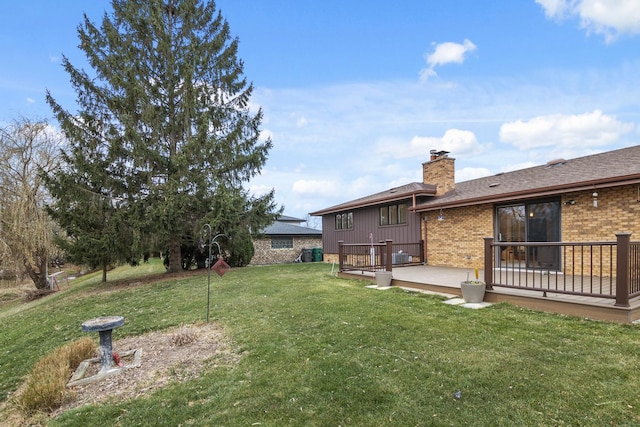 view of yard with a wooden deck